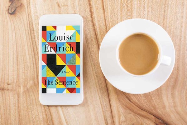 The Sentence book club questions with book cover and coffee mug.