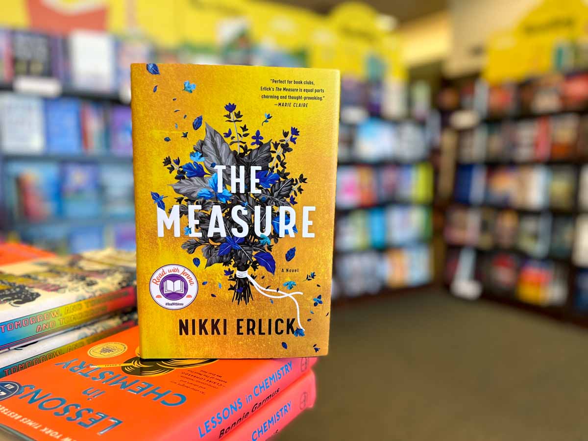 The Measure book club questions, with book cover and bookshelves.
